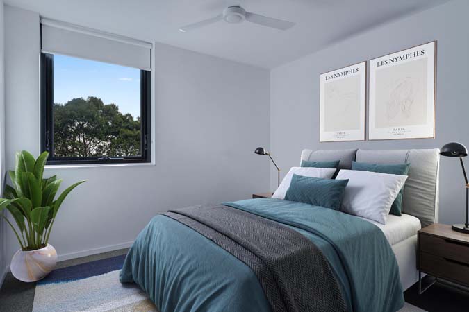 Inside a new home at Victoria Street, Flemington. Bedroom with two windows and a large bed