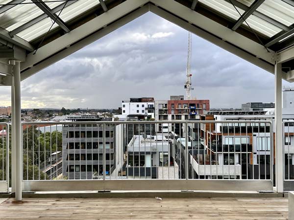 view from a balcony looking at apartments