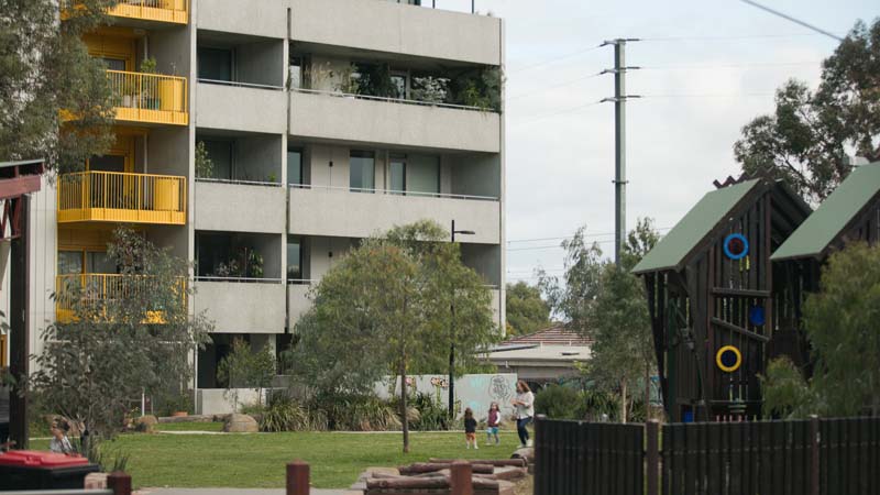 Park and play equipment in front of apartments