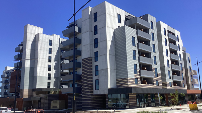 Apartment towers in front of blue sky