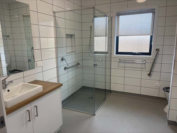 bathroom with shower and toilet