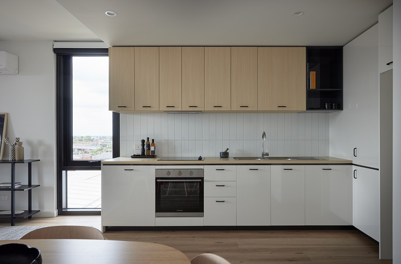 image of modern kitchen with beautify cabinets, pantry, electric stove and sink