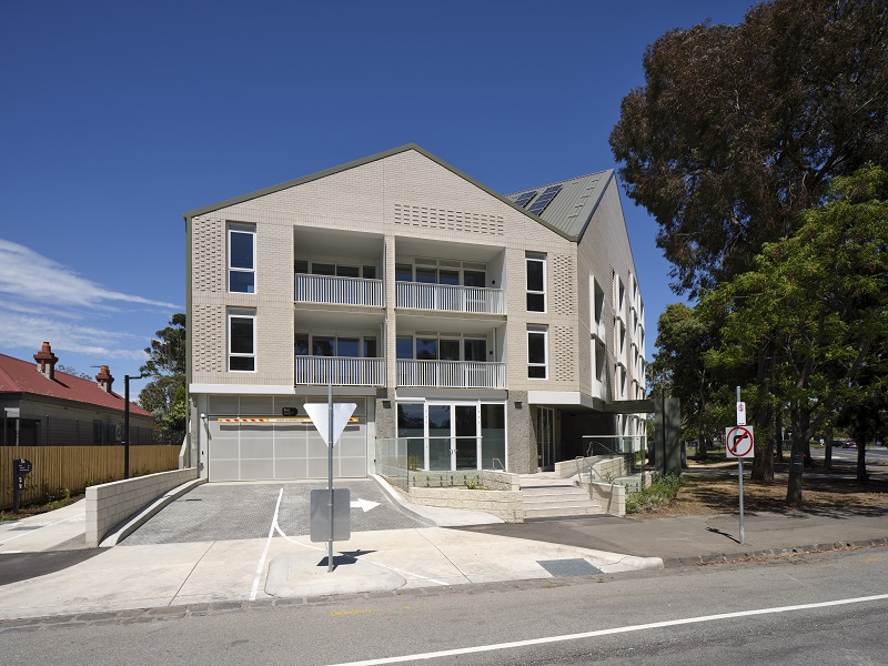 Image of new street Brighton building showing way towards parking area