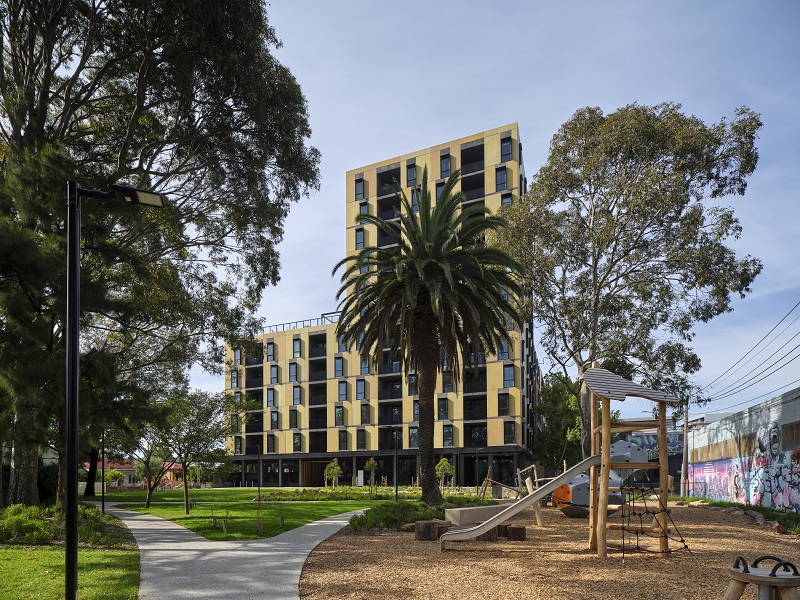 Image of Bangs Street, Prahran building with beautiful landscape, walking pathway, play area for children and bench to sit