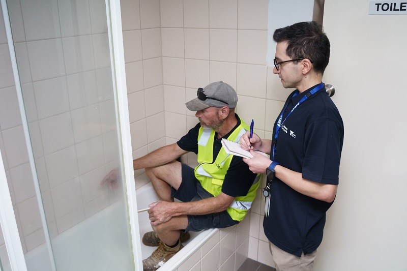 Image of new social housing repair crews fixing renters bathroom