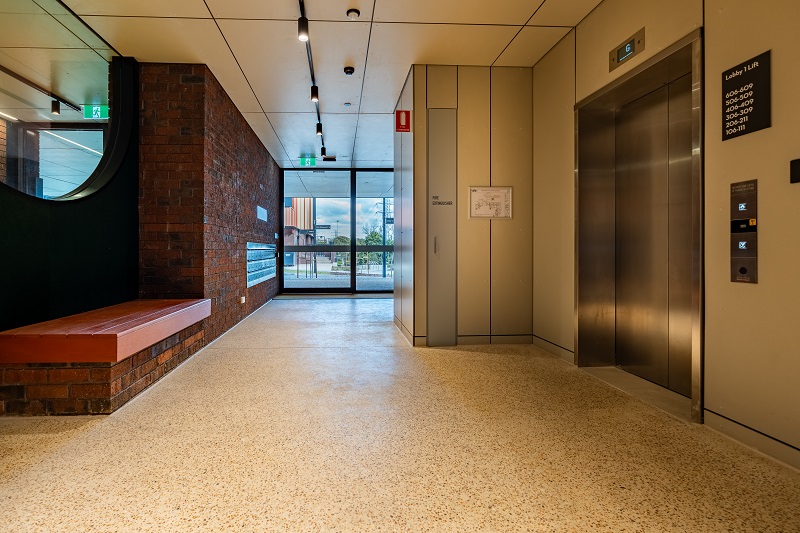 View of new foyer with seating and lifts