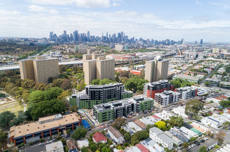 Drone image of the Victoria Street housing development is completed and surrounded with green trees, oval and local community