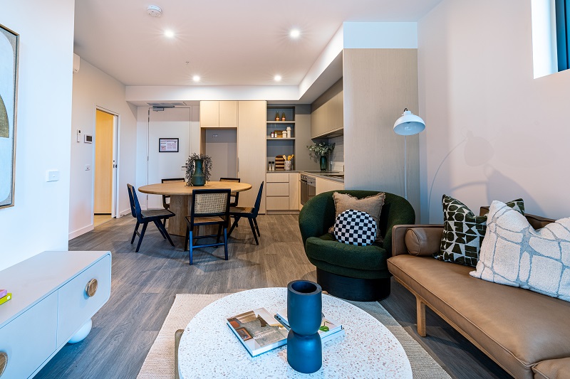 Image of modern lounge and dining area in a market housing apartment.