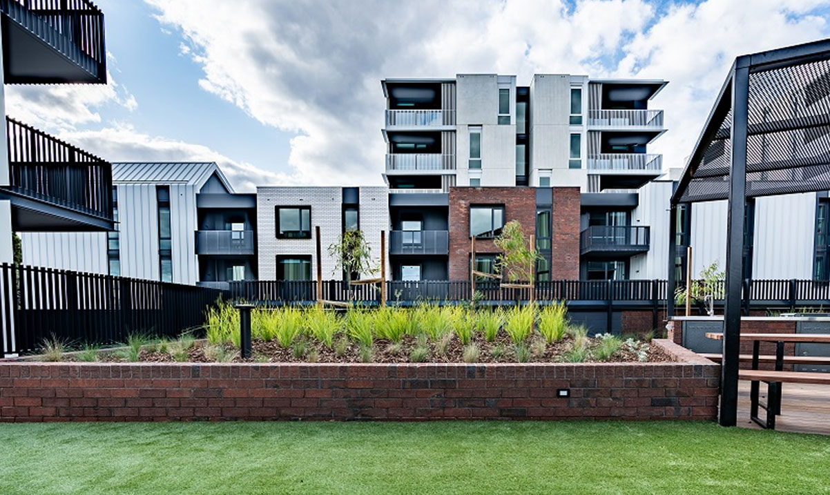 Image of resident common area surrounded by greenery