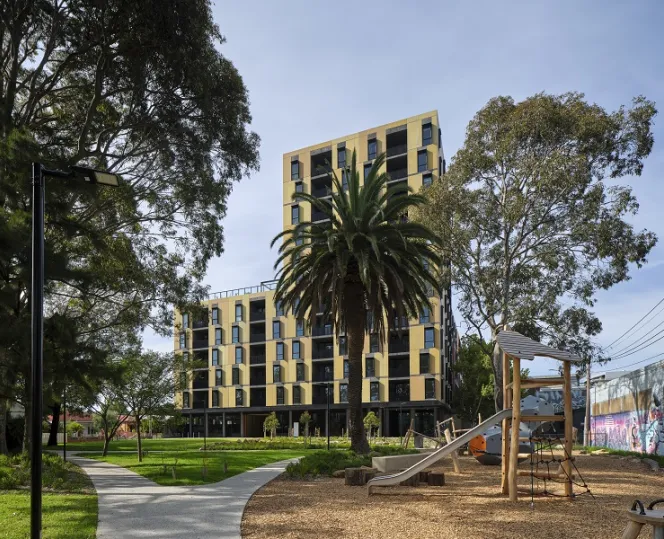 Image of Bangs Street, Prahran building with beautiful landscape, walking pathway, play area for children and bench to sit