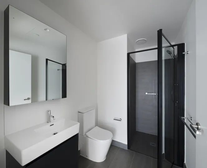 Image modern bathroom with large vanity and sink and toilet