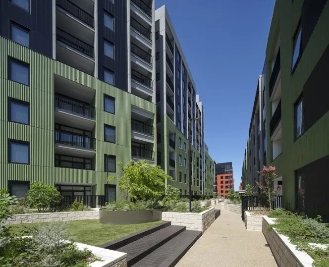 Path with a new apartment building on either side