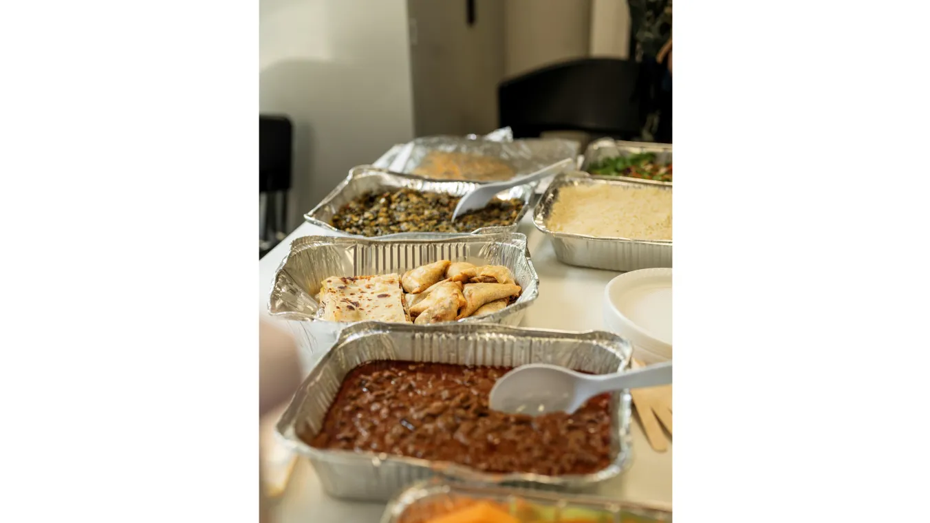 Several dishes in aluminium tray on a table