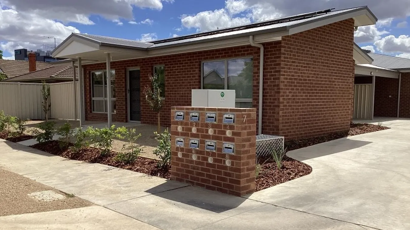 Image of the new homes with beautiful plantation and letter box at the front